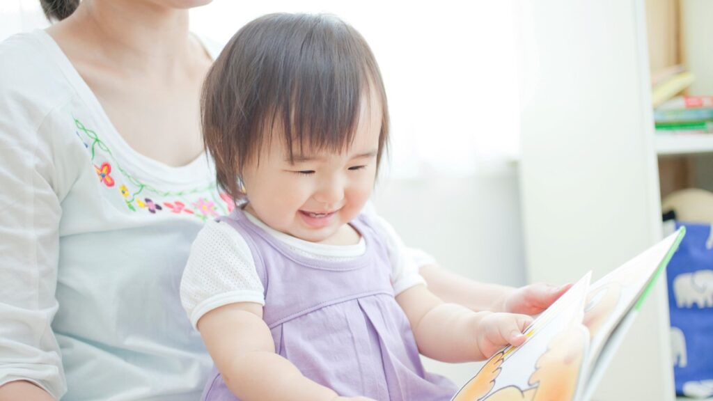 child reads picture book